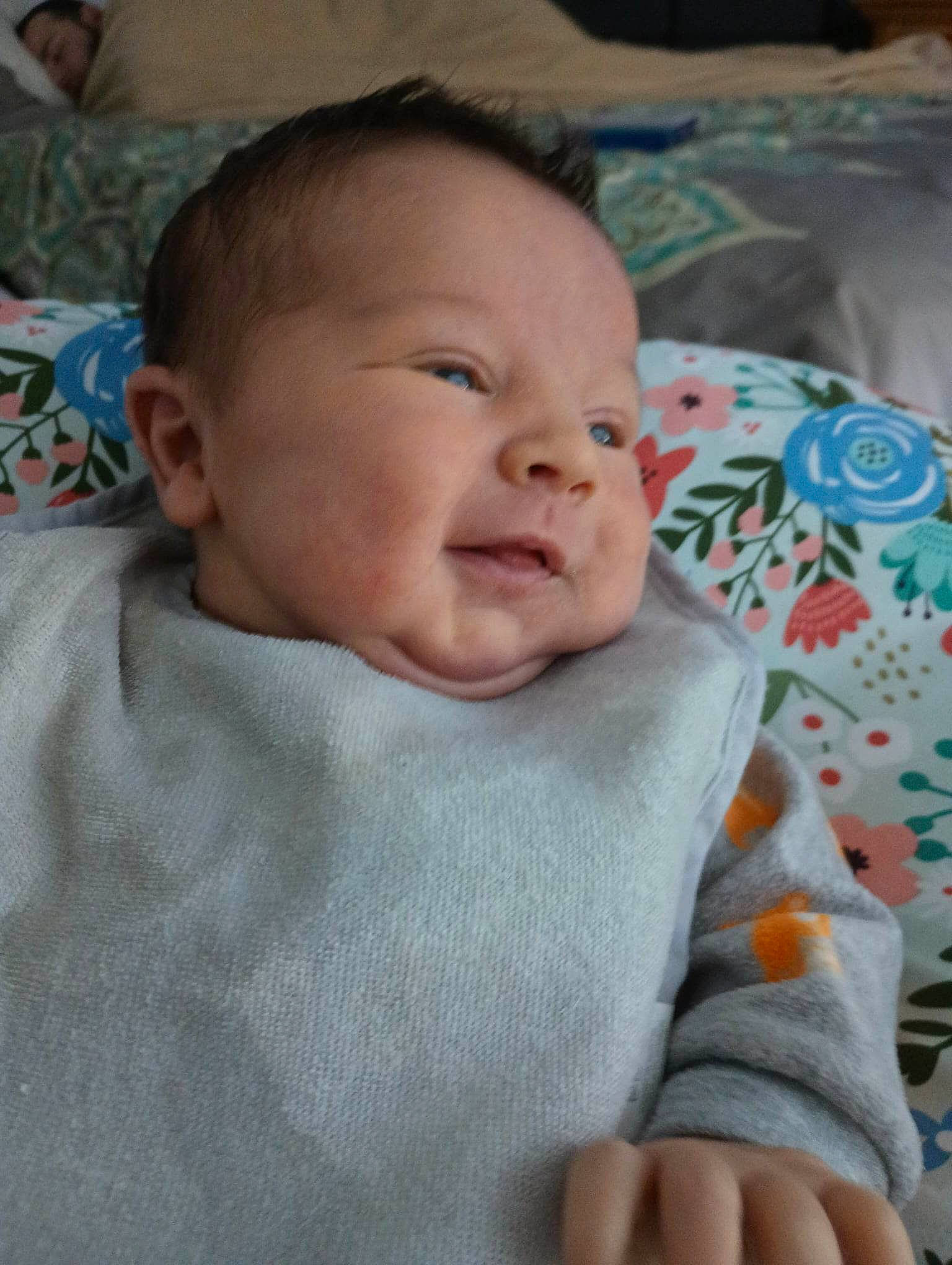 Phenyx is registered to the contest to win money with this photo: baby, baby_toddler_clothing, bedtime, cheek, child, comfort, finger, grass, iris, linens, mouth, nail, nose, pattern, person, skin, sleeve, smile, thumb, toddler