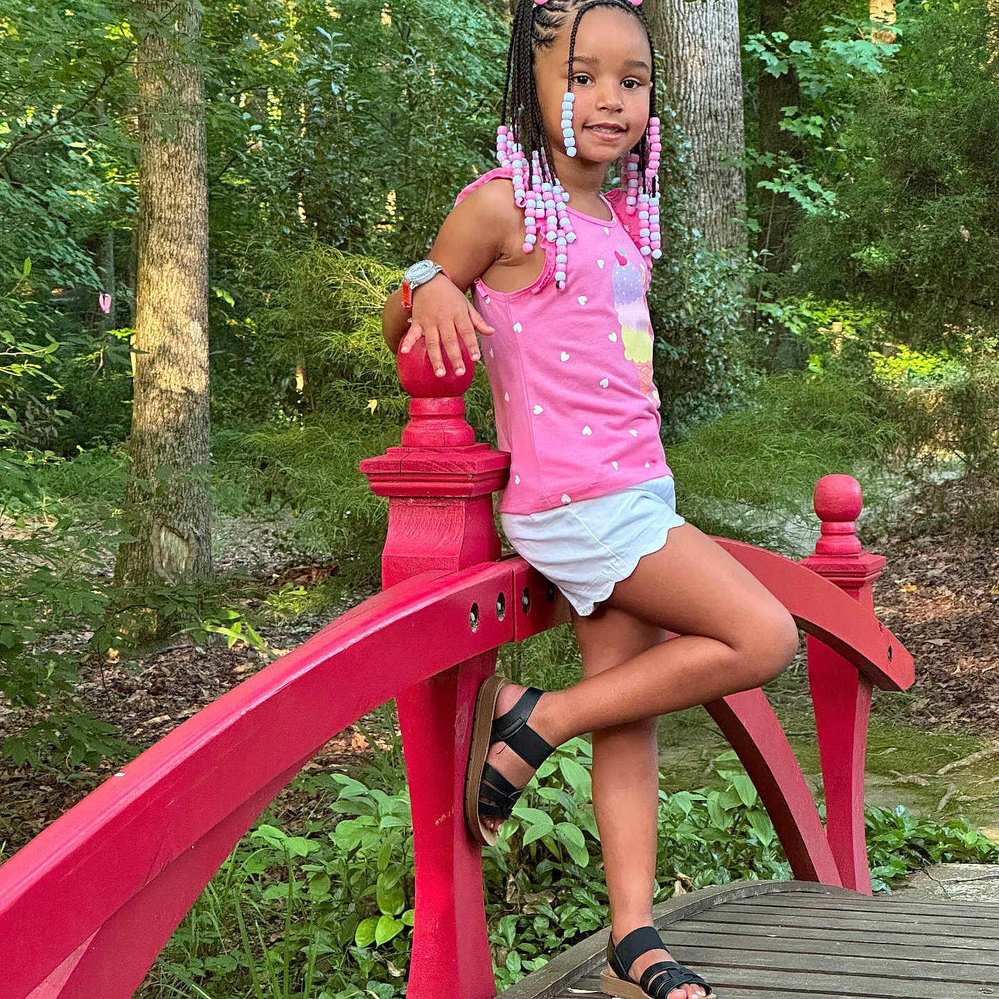 Brooklyn is registered to the contest to win money with this photo: clothing, dress, face, footwear, grass, head, nature, outdoors, park, path, person, photography, plant, portrait, sandal, shoe, sitting, summer, tree, vegetation