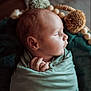 baby, newborn, swaddled, sleeping, infant, blanket, soft_texture, hands, face, profile, peaceful, cozy, warm_lighting, portrait, closeup, cute, resting, indoor, child, nursery