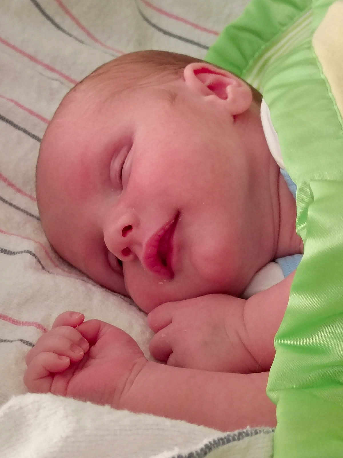 Micah is registered to the contest to win money with this photo: baby, sleeping, blanket, green_blanket, hand, face, newborn, infant, peaceful, resting, closeup, skin, cute, child, portrait, cozy, soft, bed, sleep, toddler