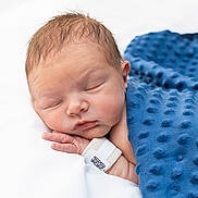 Nathan is registered to the contest to win money with this photo: newborn, baby, sleeping, blanket, blue_blanket, hospital_wristband, infant, peaceful, resting, soft_texture, closeup, skin, hand, face, portrait, indoors, child, cute, newborn_baby, wrapped