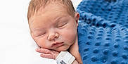 Nathan is registered to the contest to win money with this photo: baby, blanket, blue_blanket, child, closeup, cute, face, hand, hospital_wristband, indoors, infant, newborn, newborn_baby, peaceful, portrait, resting, skin, sleeping, soft_texture, wrapped