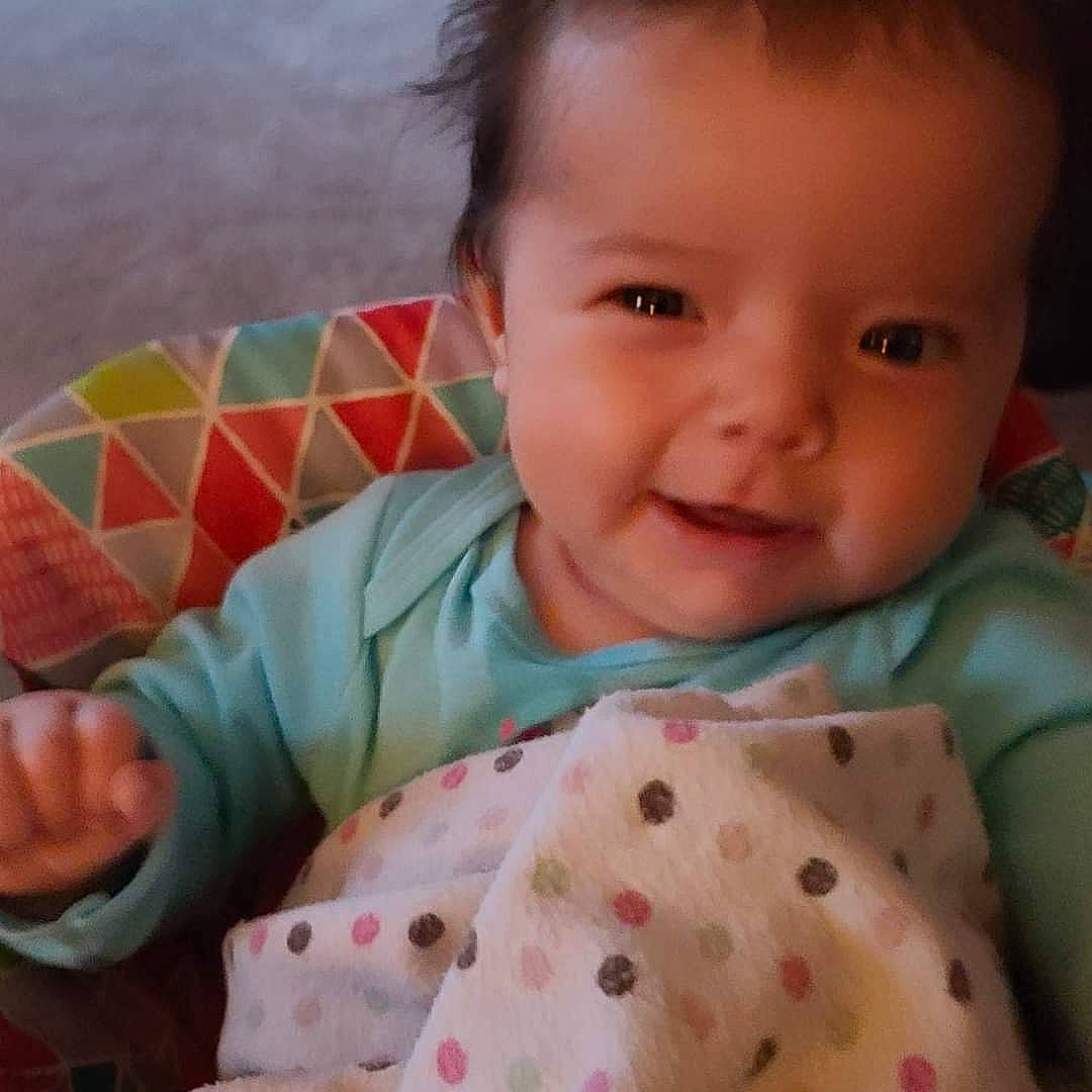 Esmae joined the competition — help win amazing prizes! arm, baby_toddler_clothing, cheek, chin, comfort, ear, eye, face, facial_expression, hand, human, human_body, lip, mouth, neck, nose, person, product, skin, sleeve