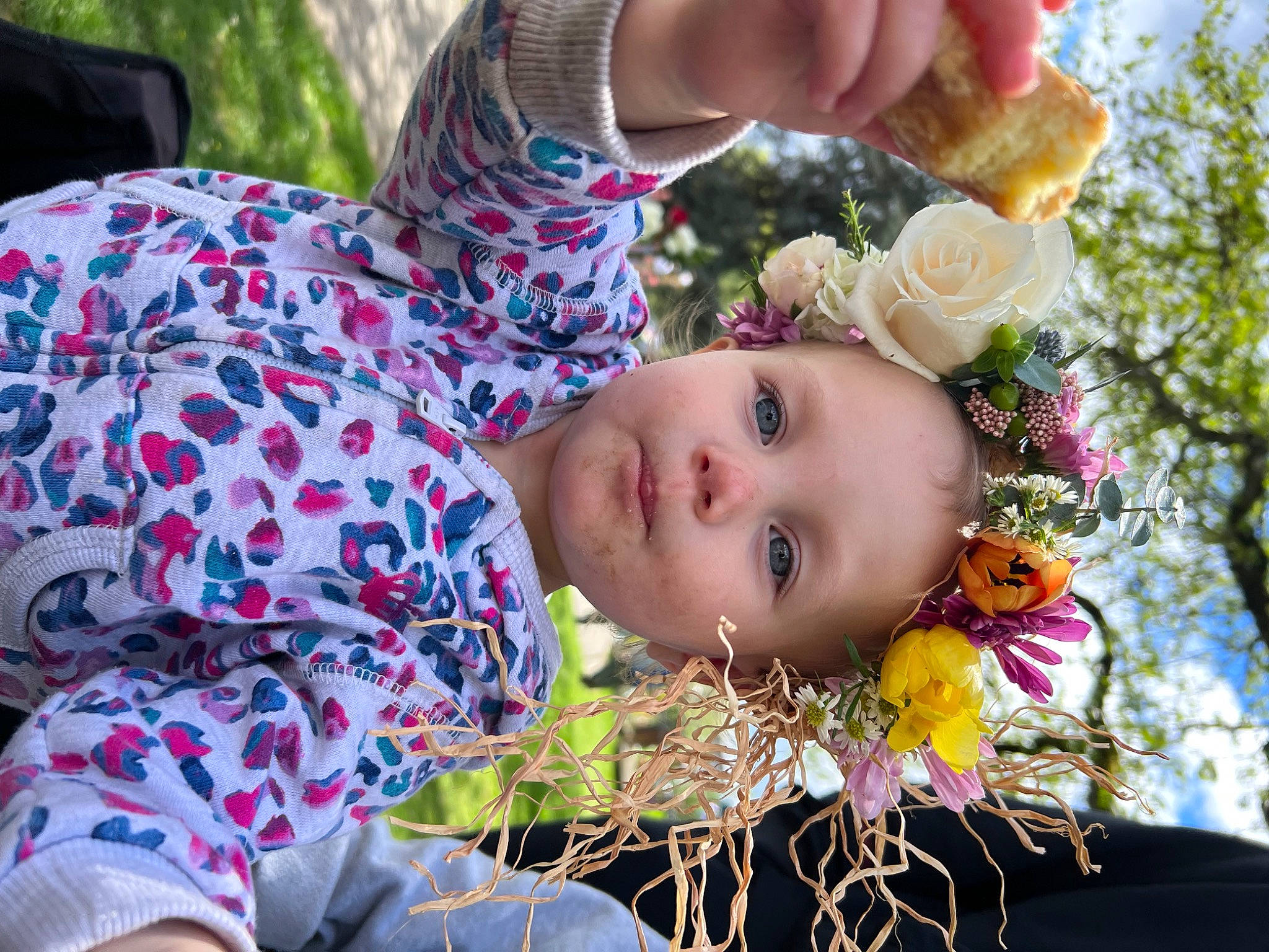 Layla is registered to the contest to win money with this photo: baby, child, flower, flowering_plant, fun, grass, happy, head, leisure, people_in_nature, person, petal, plant, recreation, rose, rose_family, rose_order, sitting, toddler, tree