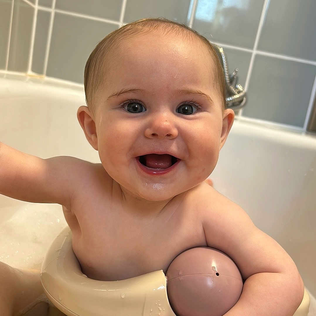 Elsie joined the competition — help win amazing prizes! arm, baby, bath, bathroom, bathtub, child, cute, face, faucet, happy, head, infant, mouth, play, sitting, skin, smiling, tiled_wall, toy, water