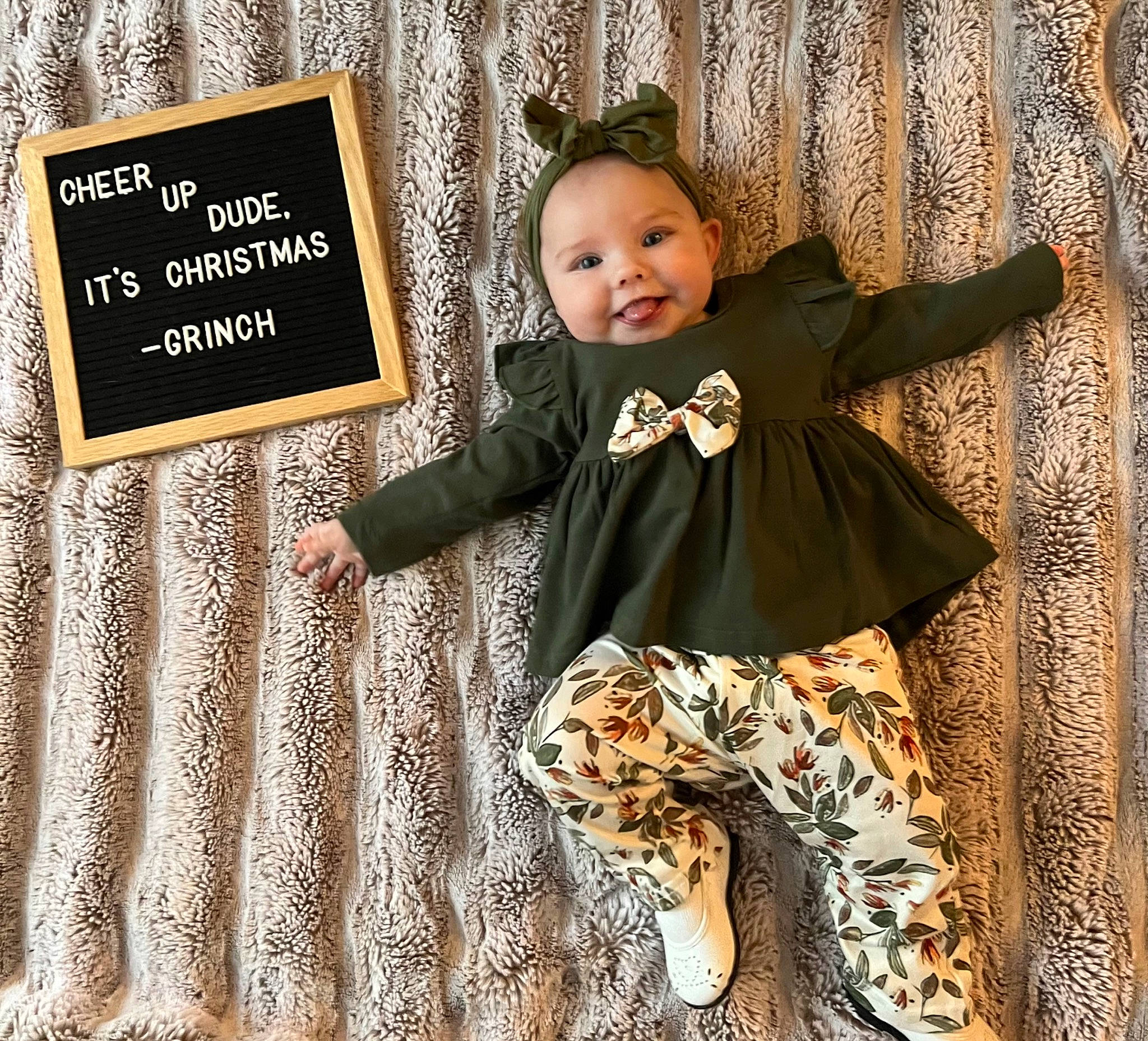 Rhaelynn is registered to the contest to win money with this photo: baby, baby_toddler_clothing, child, facial_expression, happy, headwear, human, joy, mammal, outerwear, pattern, people_in_nature, person, picture_frame, product, rectangle, sleeve, smile, standing, t_shirt