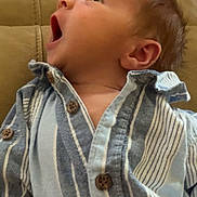 Waylon joined the competition — help win amazing prizes! baby, infant, child, portrait, face, yawning, open_mouth, looking_up, striped_shirt, clothing, couch, indoors, home, seated, close_up, young_child, head, ear, brown_hair, casual