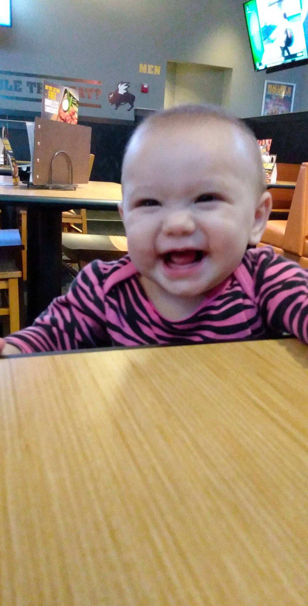 Maliyah is registered to the contest to win money with this photo: baby, cheek, child, chin, face, facial_expression, floor, flooring, forehead, head, laugh, lip, nose, person, skin, smile, toddler, wood