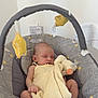 baby, sleeping, infant, baby_swing, blanket, plush_toy, toddler, indoor, soft_toy, graco, yellow, gray, floor, carpet, child, peaceful, resting, cute, infant_clothing, baby_accessory