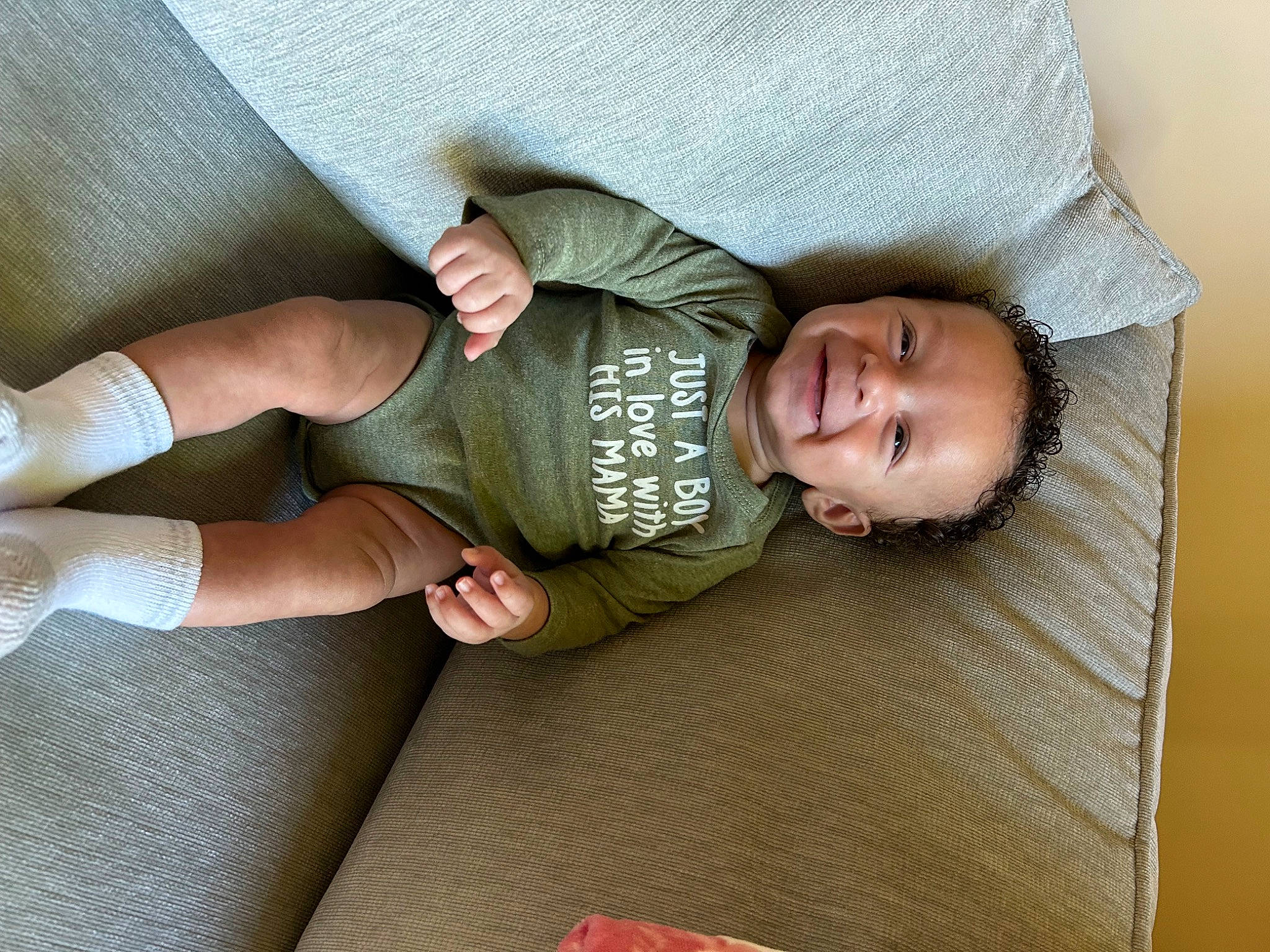 Kenzo joined the competition — help win amazing prizes! arm, baby, baby_toddler_clothing, comfort, couch, finger, floor, flooring, gesture, human_leg, joint, joy, knee, leg, person, product, skin, sleeve, smile, sock