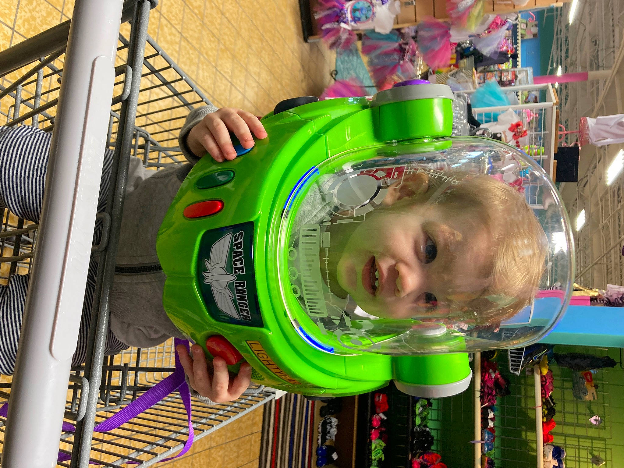Daniel is registered to the contest to win money with this photo: amusement_ride, baby, baby_products, baby_toys, child, fun, green, leisure, person, play, recreation, retail, supermarket, toddler