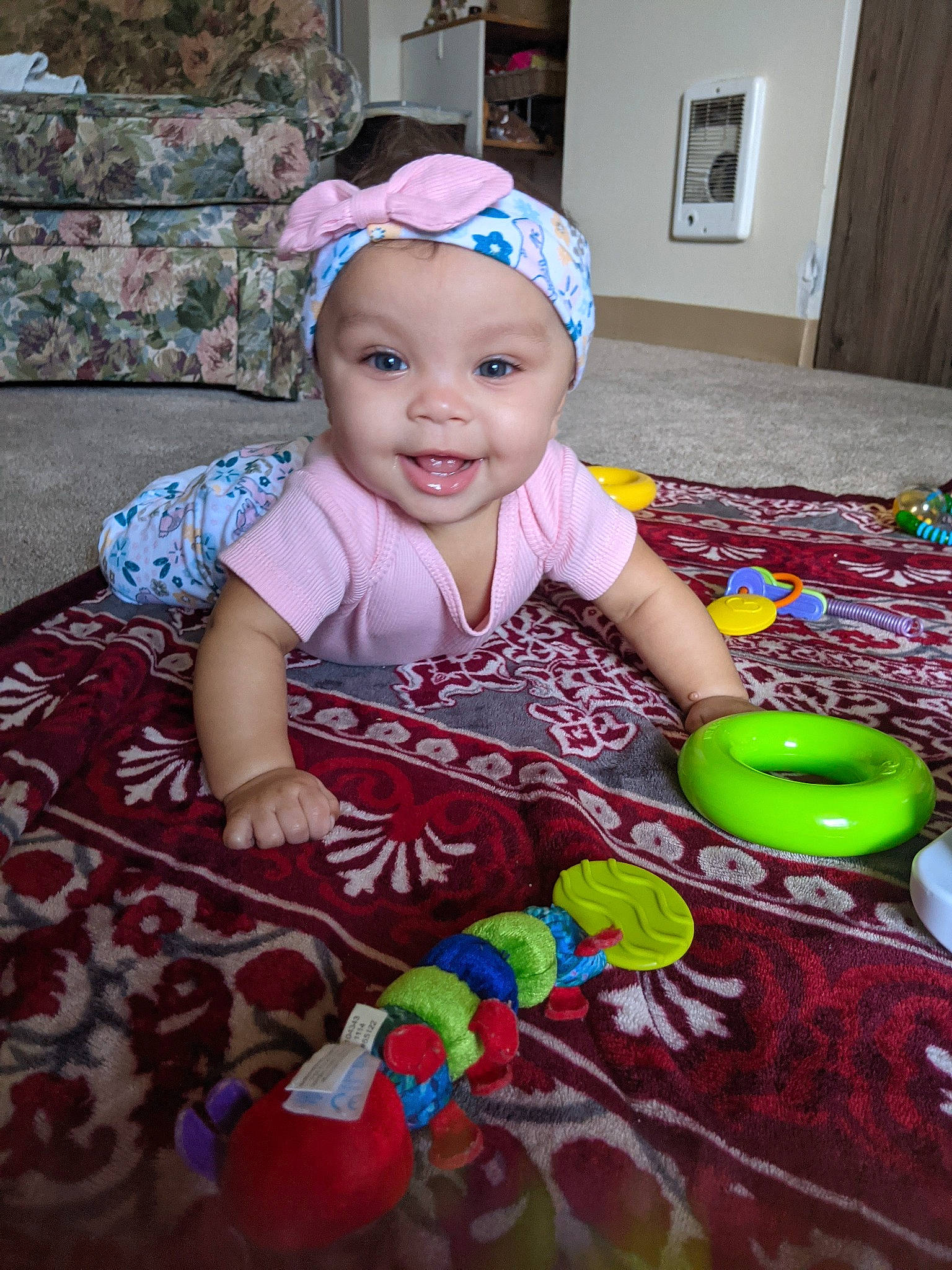 Jillian joined the competition — help win amazing prizes! baby, baby_playing_with_toys, baby_toddler_clothing, baseball_cap, cap, child, door, event, face, flooring, fun, happy, headwear, joy, party, person, picture_frame, room, sitting, smile