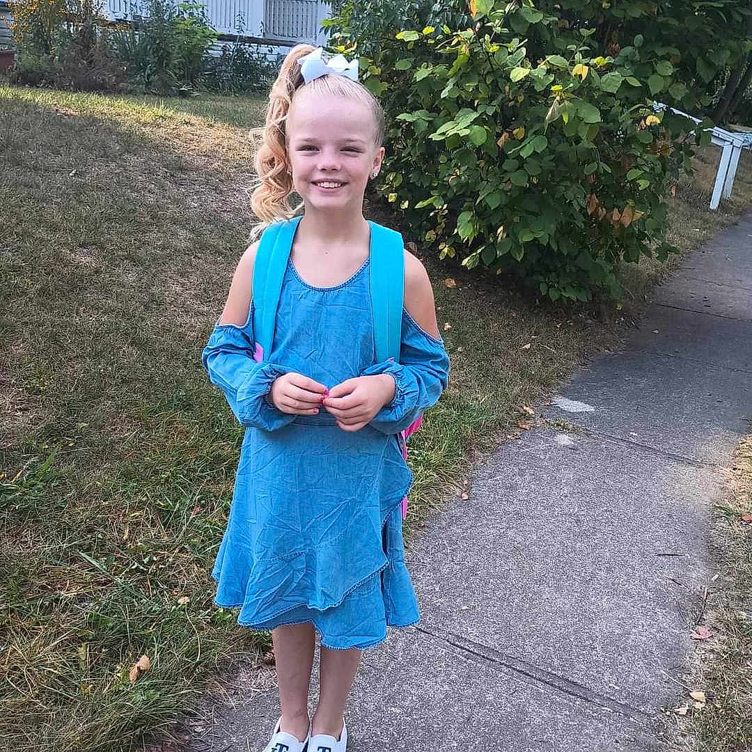 Journey is registered to the contest to win money with this photo: backyard, blonde, child, clothing, curlyhair, female, girl, hair, lady, nature, outdoors, person, racket, sitting, sleeve, sport, standing, tennis, tennisracket, yard