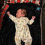Damon is registered to the contest to win money with this photo: newborn, baby, sleeping, onesie, dinosaur_pattern, blanket, plaid, pacifier, infant, cute, cozy, indoors, child, clothing, portrait, resting, soft, babywear, peaceful, lying_down