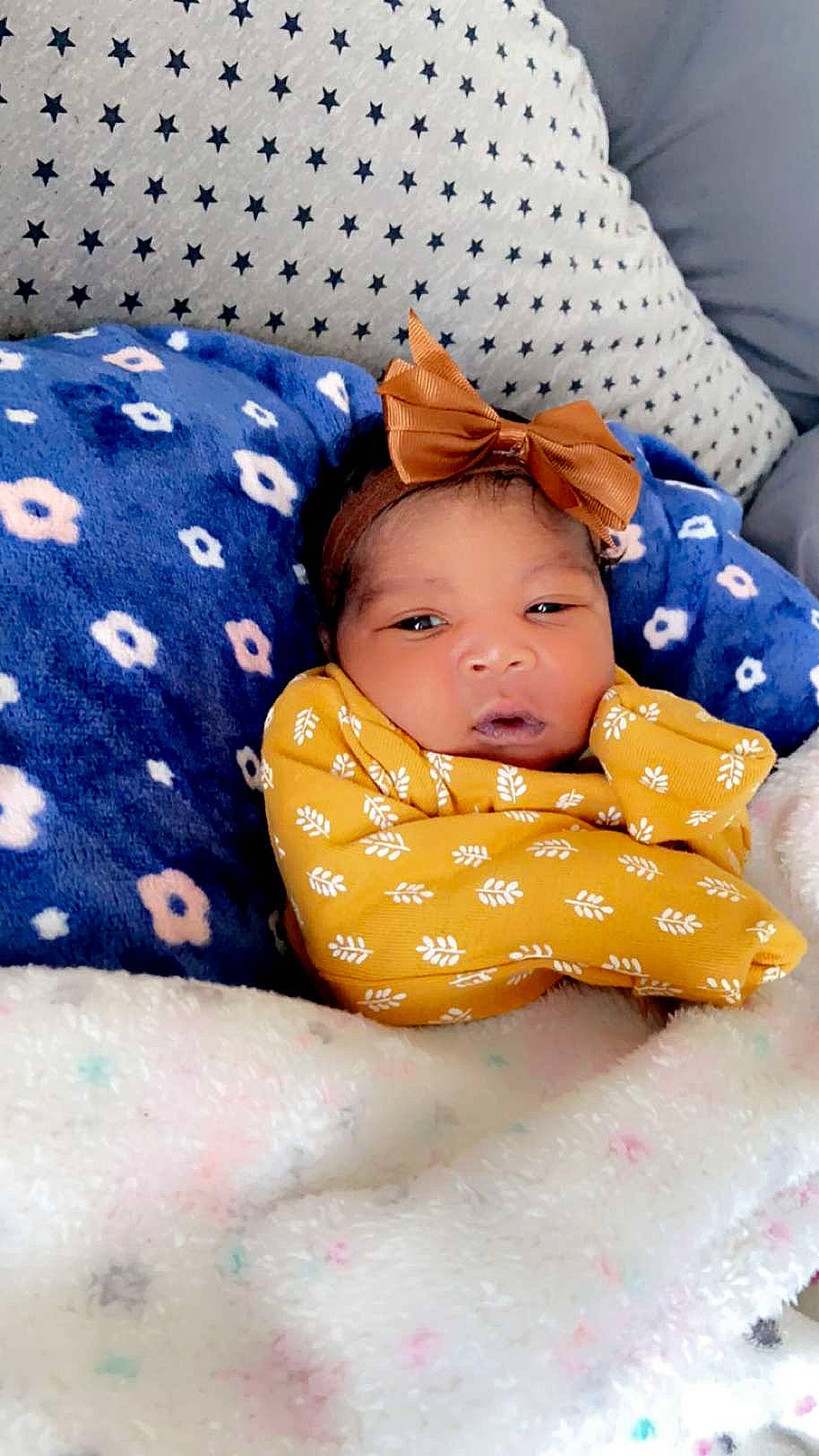 Keilani Bush is registered to the contest to win money with this photo: baby, baby_products, baby_safety, baby_sleeping, baby_toddler_clothing, bed_sheet, bedding, bedtime, child, comfort, happy, headwear, linens, pattern, person, portrait_photography, room, sitting, sleep, sleeve