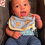 baby, child, car_seat, bib, food, face, expression, clothing, blue, teddy_bear, sitting, indoors, cute, smile, happy, infant, person, small_hands, footwear, sock