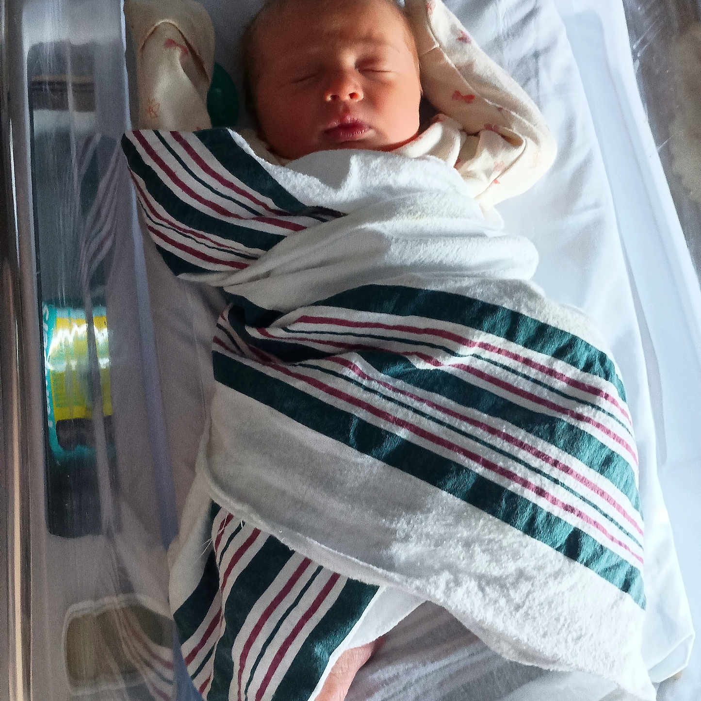 Isabella is registered to the contest to win money with this photo: architecture, baby, bed, blanket, building, cradle, crib, face, furniture, head, homedecor, hospital, infantbed, newborn, person, photography, portrait, quilt, sleeping, towel