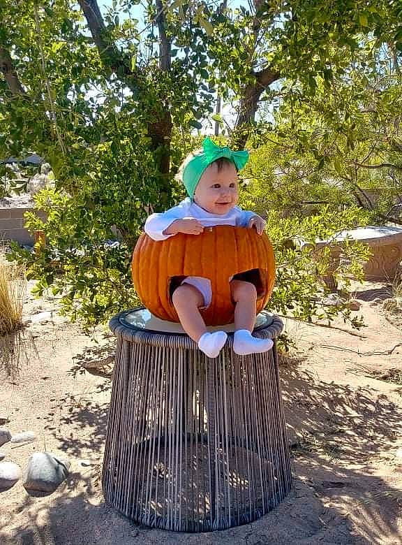 Akira is registered to the contest to win money with this photo: baby_toddler_clothing, fun, grass, hat, headwear, leisure, people_in_nature, person, plant, pumpkin, recreation, sitting, smile, soil, toddler, tree, vacation, wood