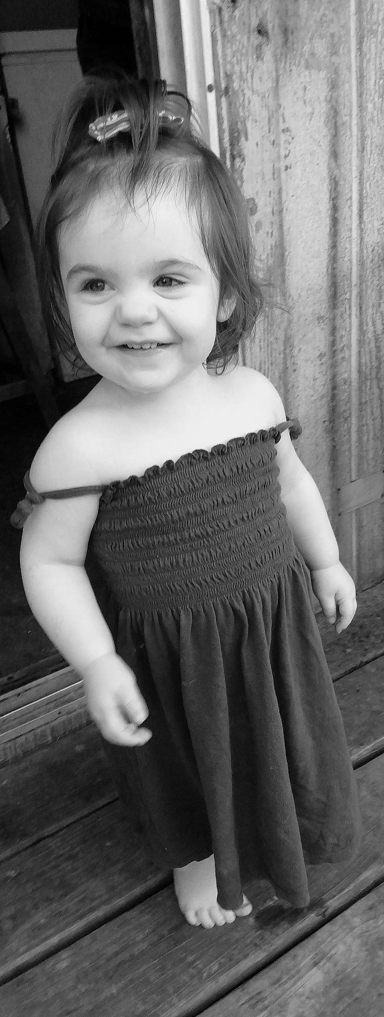 Aubrey is registered to the contest to win money with this photo: black, black_and_white, dress, eye, face, flash_photography, grey, hand, head, iris, joy, neck, organ, person, photograph, shoulder, skin, sleeve, smile, standing