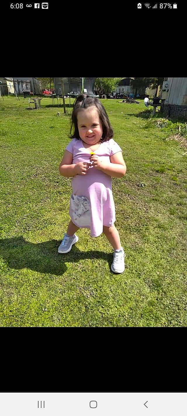 Paisley is registered to the contest to win money with this photo: baby_toddler_clothing, face, fun, gesture, grass, hair, happy, head, joy, lawn, leisure, meadow, people_in_nature, person, plant, recreation, smile, summer, thigh, thumb