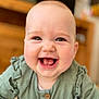 baby, smiling, child, face, green_clothing, drool, indoor, portrait, happy, cute, infant, ruffles, buttoned_shirt, closeup, young, person, skin, eyes, mouth, head