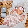 Callie joined the competition — help win amazing prizes! baby, newborn, sleeping, basket, blanket, headband, bow, flower_pattern, infant, cute, soft, pink, white, blocks, age_marker, cozy, portrait, peaceful, resting, indoors