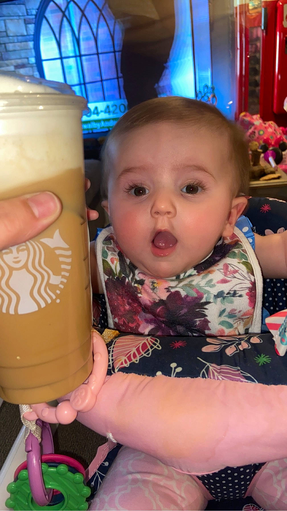 Ivey is registered to the contest to win money with this photo: baby, baby_toddler_clothing, cheek, child, drink, food, fun, happy, health_shake, ingredient, juice, magenta, non_alcoholic_beverage, person, pina_colada, sitting, skin, snapshot, surprise, sweetness