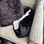 cat, sleeping, black_and_white, armchair, pillow, cozy, indoor, feline, resting, fur, pet, cute, comfort, curled_up, home, furniture, textile, relaxing, domestic, quiet
