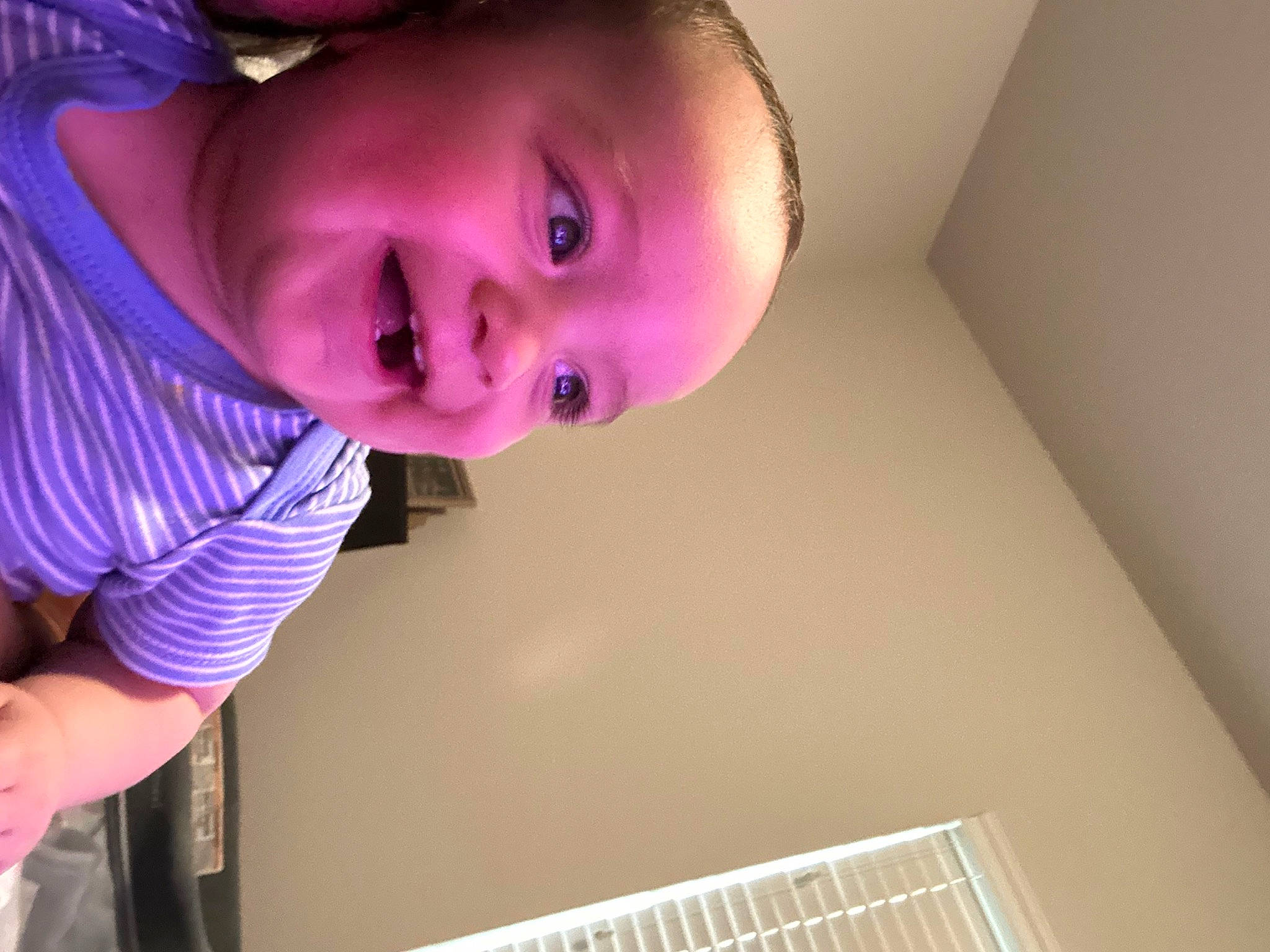 Aries is registered to the contest to win money with this photo: baby, baby_toddler_clothing, cheek, child, eyelash, face, facial_expression, fun, happy, iris, light, lip, magenta, mouth, nose, person, purple, skin, smile, toddler