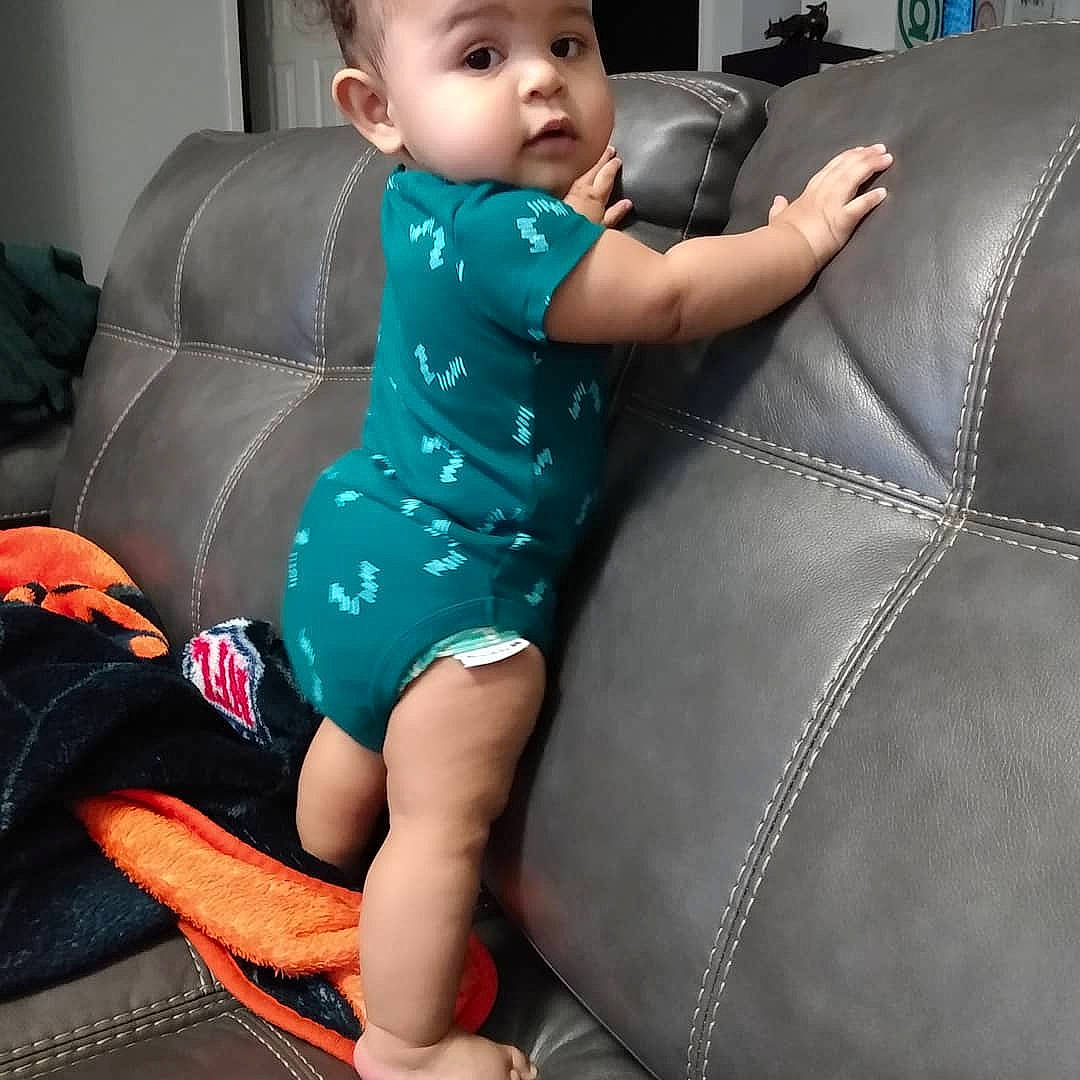 Bronson joined the competition — help win amazing prizes! arm, automotive_design, baby, baby_toddler_clothing, black_hair, car_seat, car_seat_cover, comfort, cool, electric_blue, happy, head, head_restraint, headwear, human_body, human_leg, knee, muscle, person, shorts