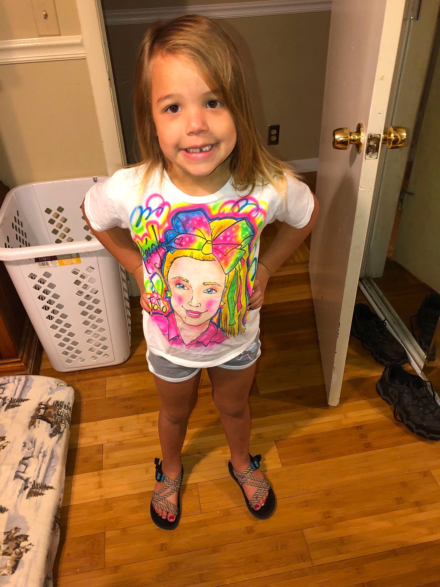 Karleigh is registered to the contest to win money with this photo: arm, child, clothing, day, finger, fun, girl, hair, headwear, human_hair_color, joy, leg, person, pink, product, shorts, shoulder, skin, smile, standing