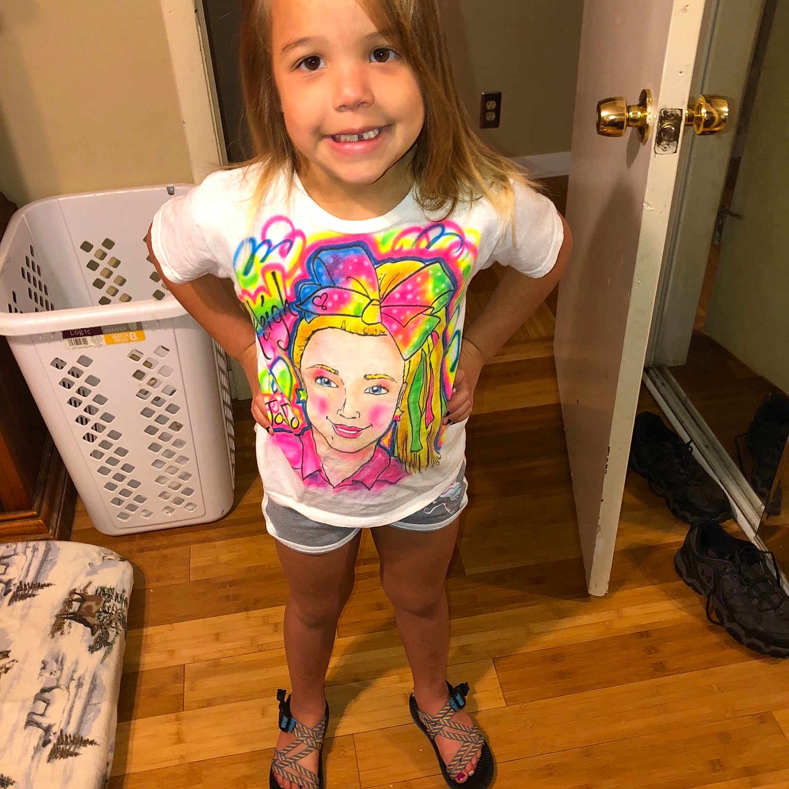 Karleigh is registered to the contest to win money with this photo: arm, child, clothing, day, finger, fun, girl, hair, headwear, human_hair_color, joy, leg, person, pink, product, shorts, shoulder, skin, smile, standing