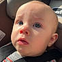baby, child, face, car_seat, seatbelt, blue_eyes, sweater, striped_clothing, button, close_up, indoors, infant, person, head, skin, expression, safety, seat, car, young