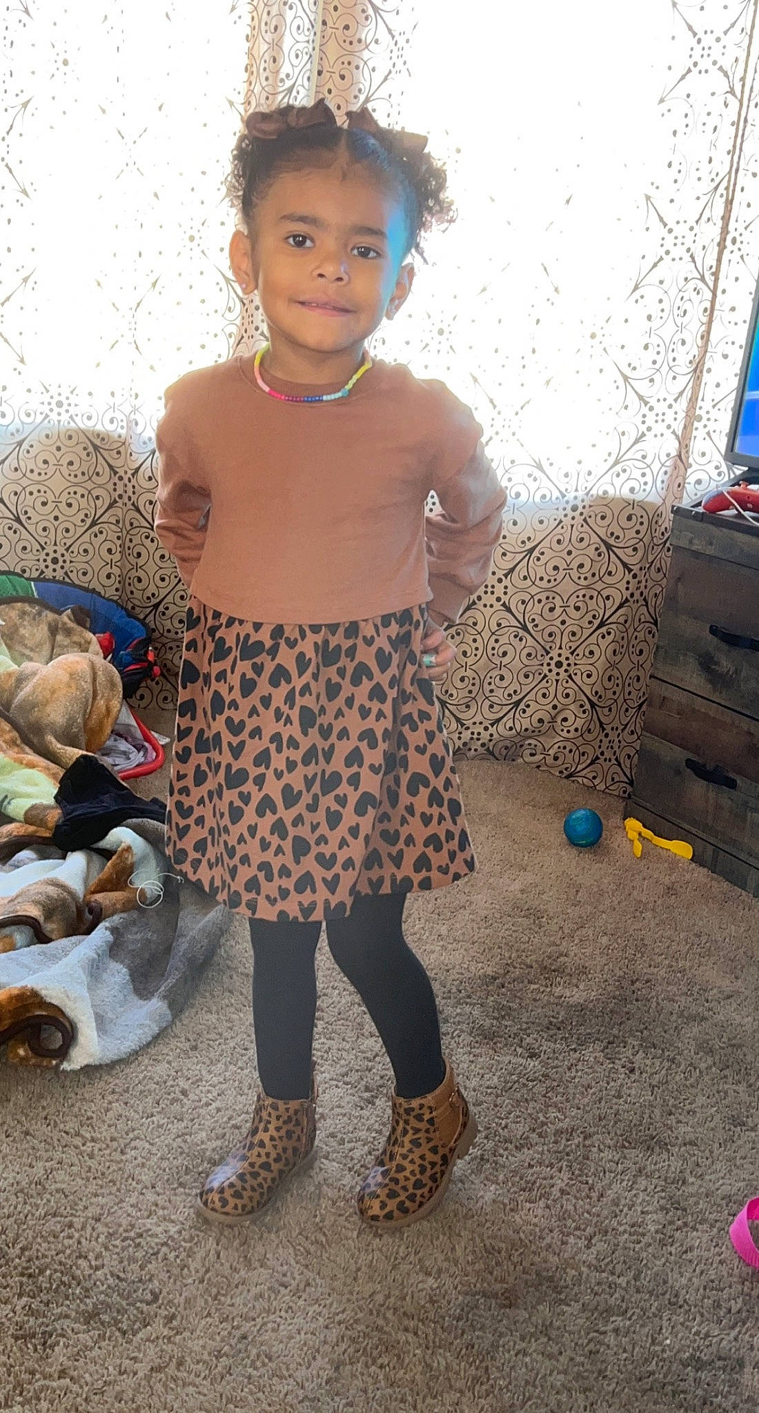 Paisley is registered to the contest to win money with this photo: adaptation, baby_toddler_clothing, child, fashion_design, flooring, fun, happy, head, human_leg, jewellery, joy, pattern, person, play, sandal, sitting, sleeve, t_shirt, toddler, toy