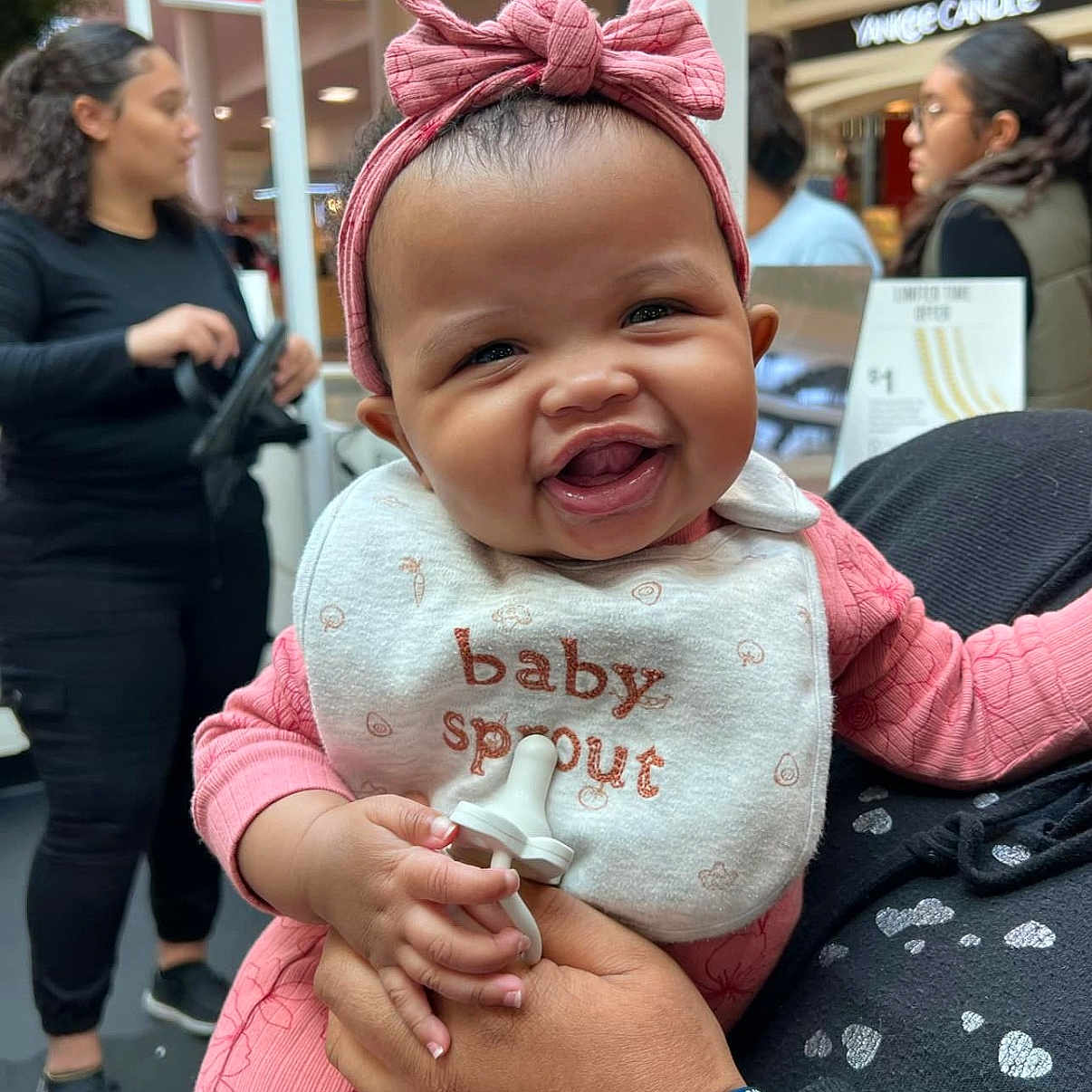 Malani joined the competition — help win amazing prizes! adult, baby, babylaughing, city, clothing, coat, face, female, happy, head, jacket, laughing, male, man, medication, people, person, photography, portrait, woman