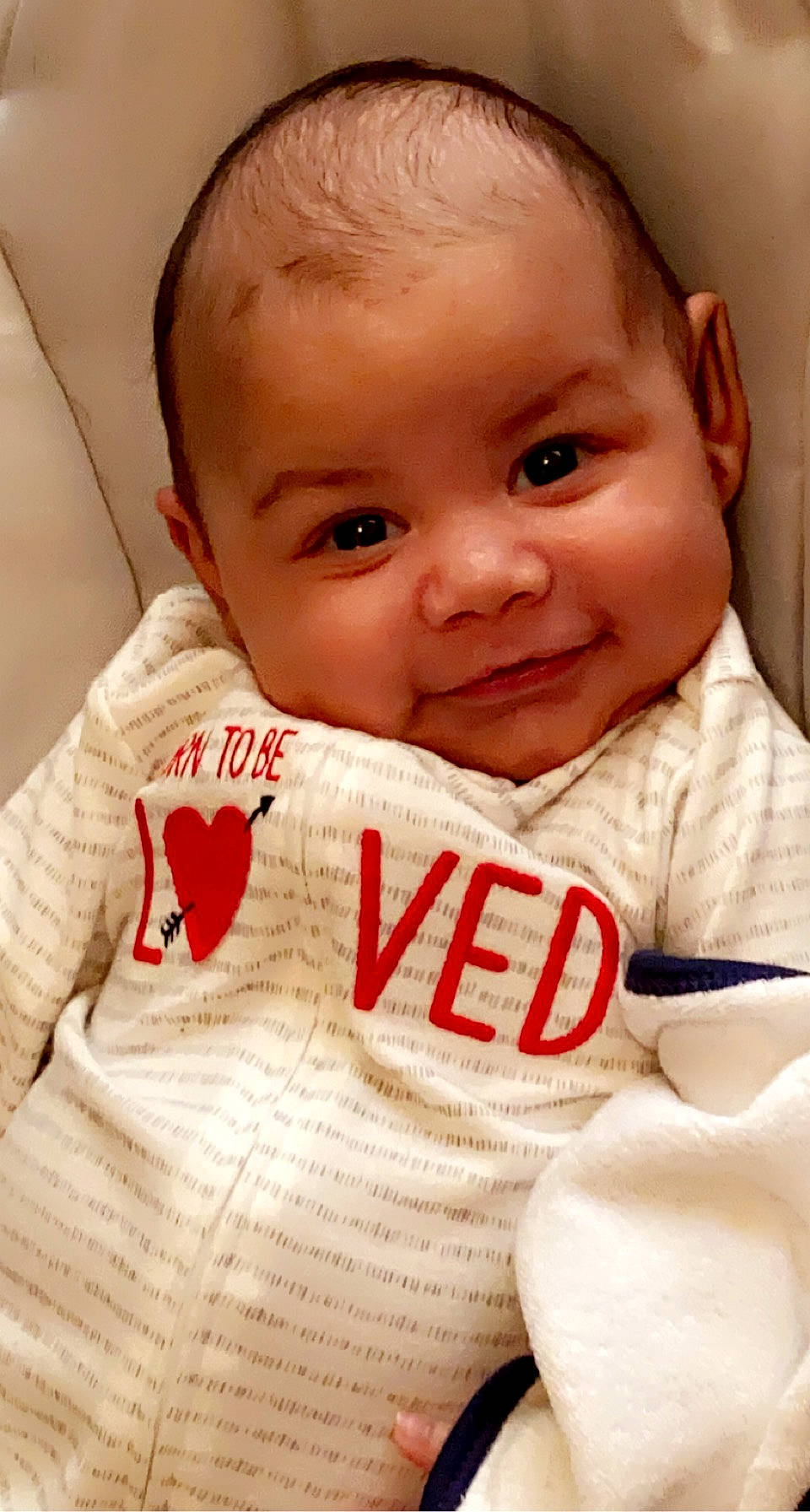 Tristan is registered to the contest to win money with this photo: baby, baby_toddler_clothing, carmine, cheek, child, chin, ear, eye, eyebrow, forehead, happy, head, iris, joy, lip, organ, person, pleased, skin, sleeve