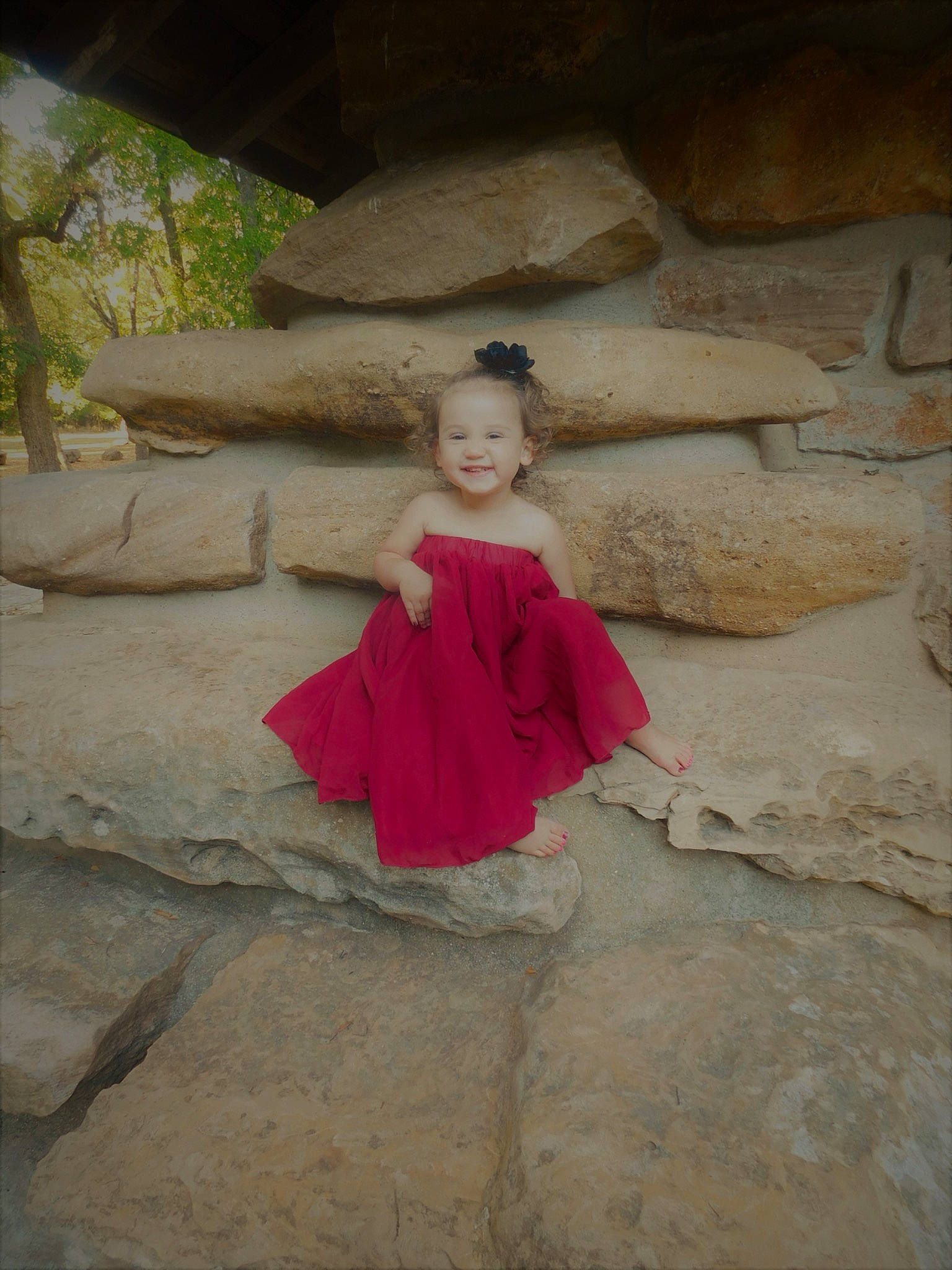 Brinley is registered to the contest to win money with this photo: child, dress, fawn, flash_photography, flooring, fun, grass, joy, landscape, leisure, person, plant, rock, sitting, soil, toddler, tourism, tree, vacation, wood