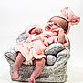 Willow joined the competition — help win amazing prizes! baby, infant, pink_clothing, hat, bow, mini_armchair, grey_fabric, soft_texture, cute, newborn, portrait, indoor, child, cozy, small_chair, relaxed, looking_up, studio, fluffy, adorable