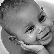 Moxie is registered to the contest to win money with this photo: baby, black_and_white, cheek, child, close_up, cute, ear, expression, eyes, face, hand, happy, head, innocence, joy, person, portrait, skin, smiling, young_child