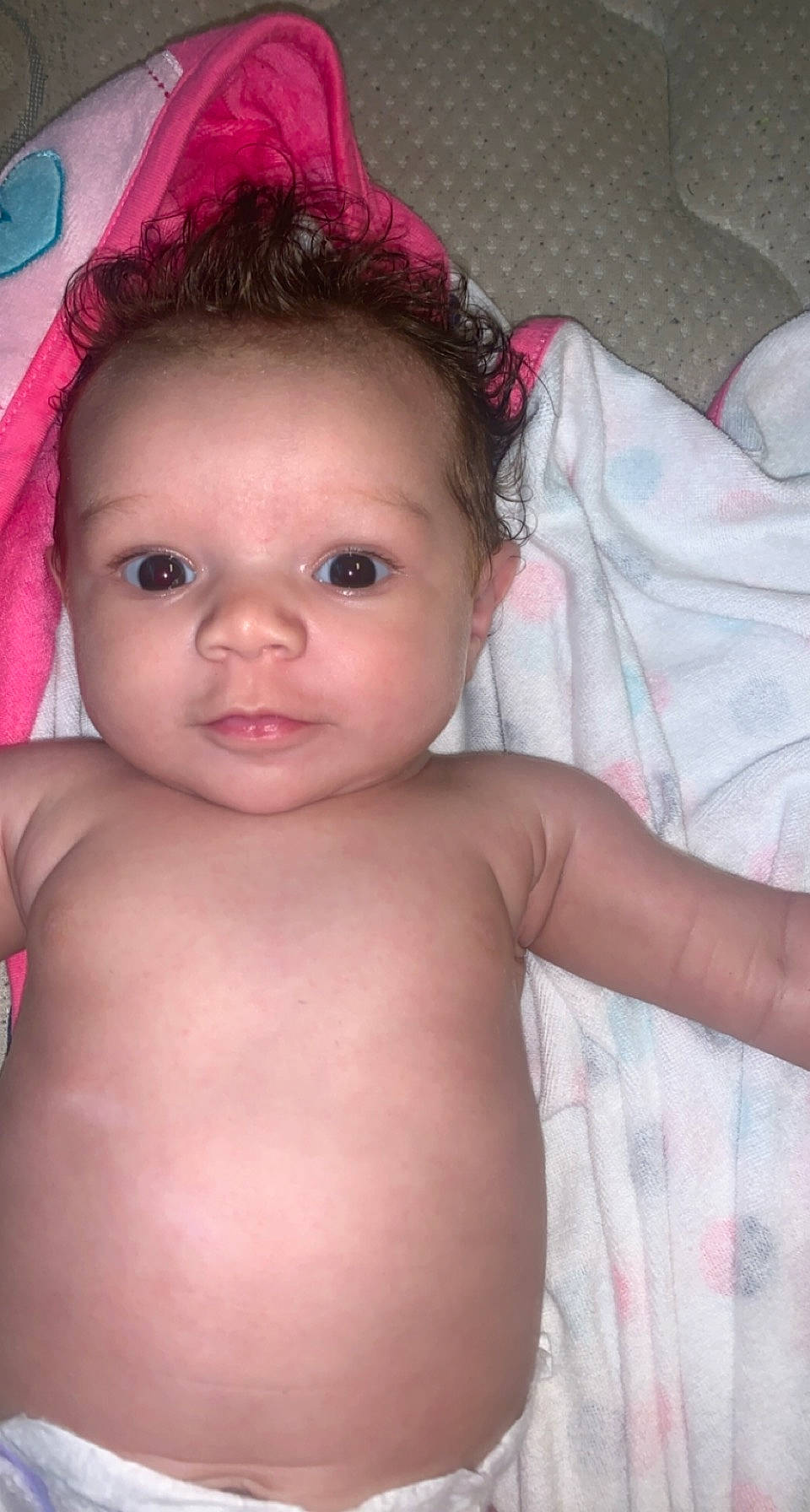 Brooklyn is registered to the contest to win money with this photo: baby, cheek, chest, chin, eye, eyebrow, eyelash, face, finger, forehead, head, human_body, iris, lip, mouth, neck, nose, person, pink, shoulder