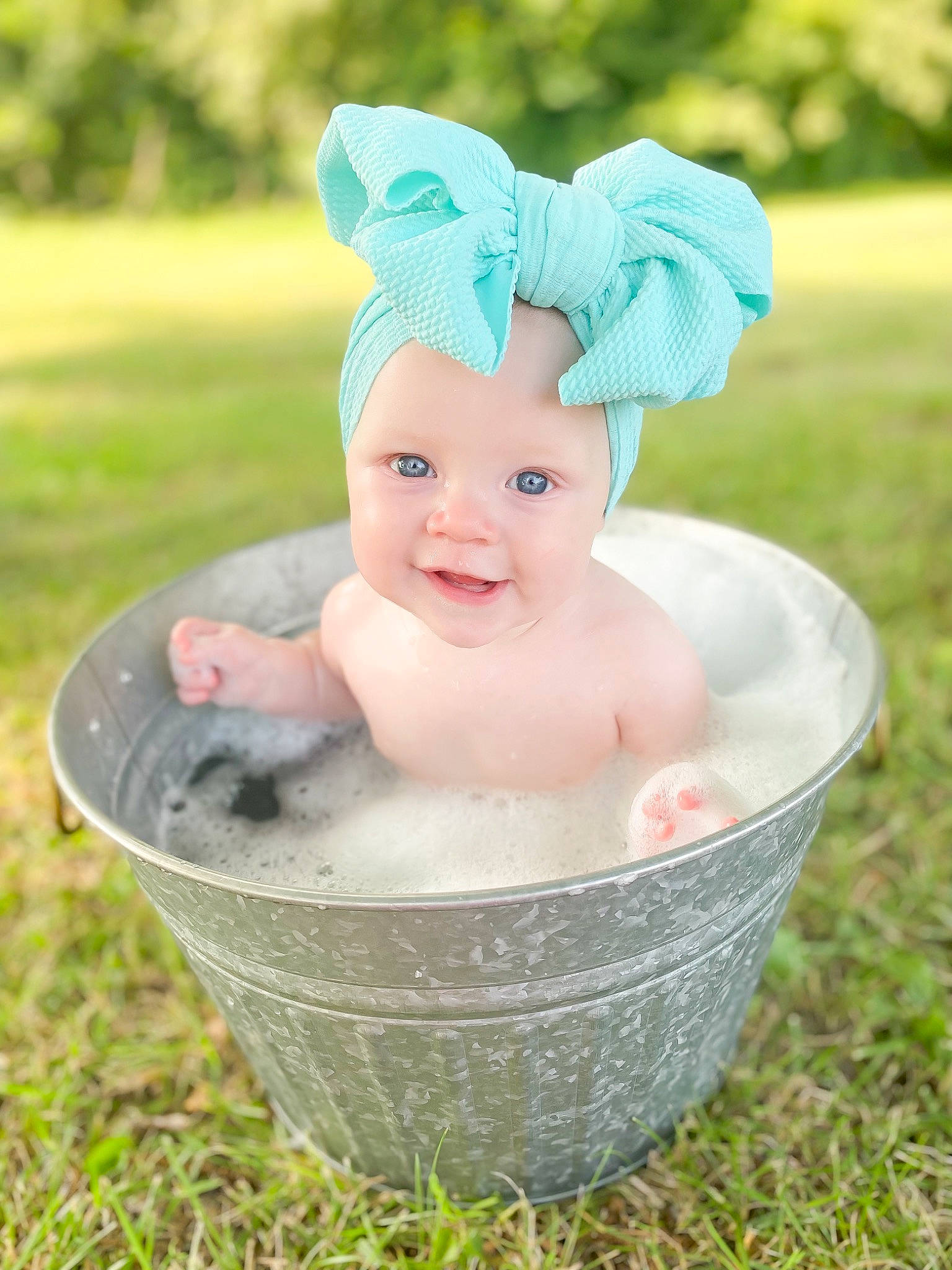 Margaret is registered to the contest to win money with this photo: baby, baby_toddler_clothing, child, costume_hat, face, fashion_accessory, fun, grass, hair_accessory, happy, head, headband, headgear, headpiece, headwear, jewellery, joy, people_in_nature, person, plant