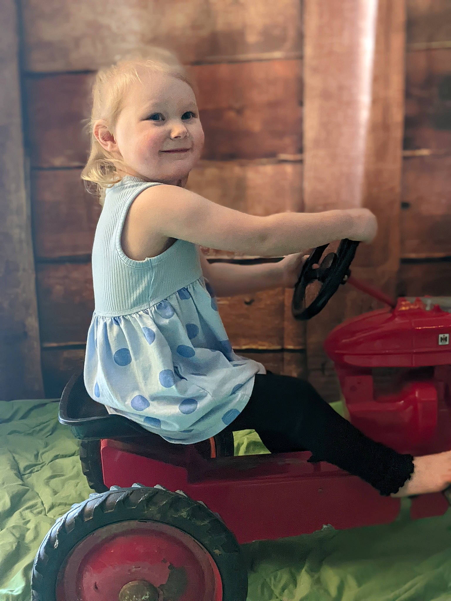 Hailey joined the competition — help win amazing prizes! automotive_tire, automotive_wheel_system, baby_toddler_clothing, blond, child, electric_blue, flash_photography, fun, happy, human_leg, joy, magenta, person, play, riding_toy, rim, shoulder, sitting, smile, tire