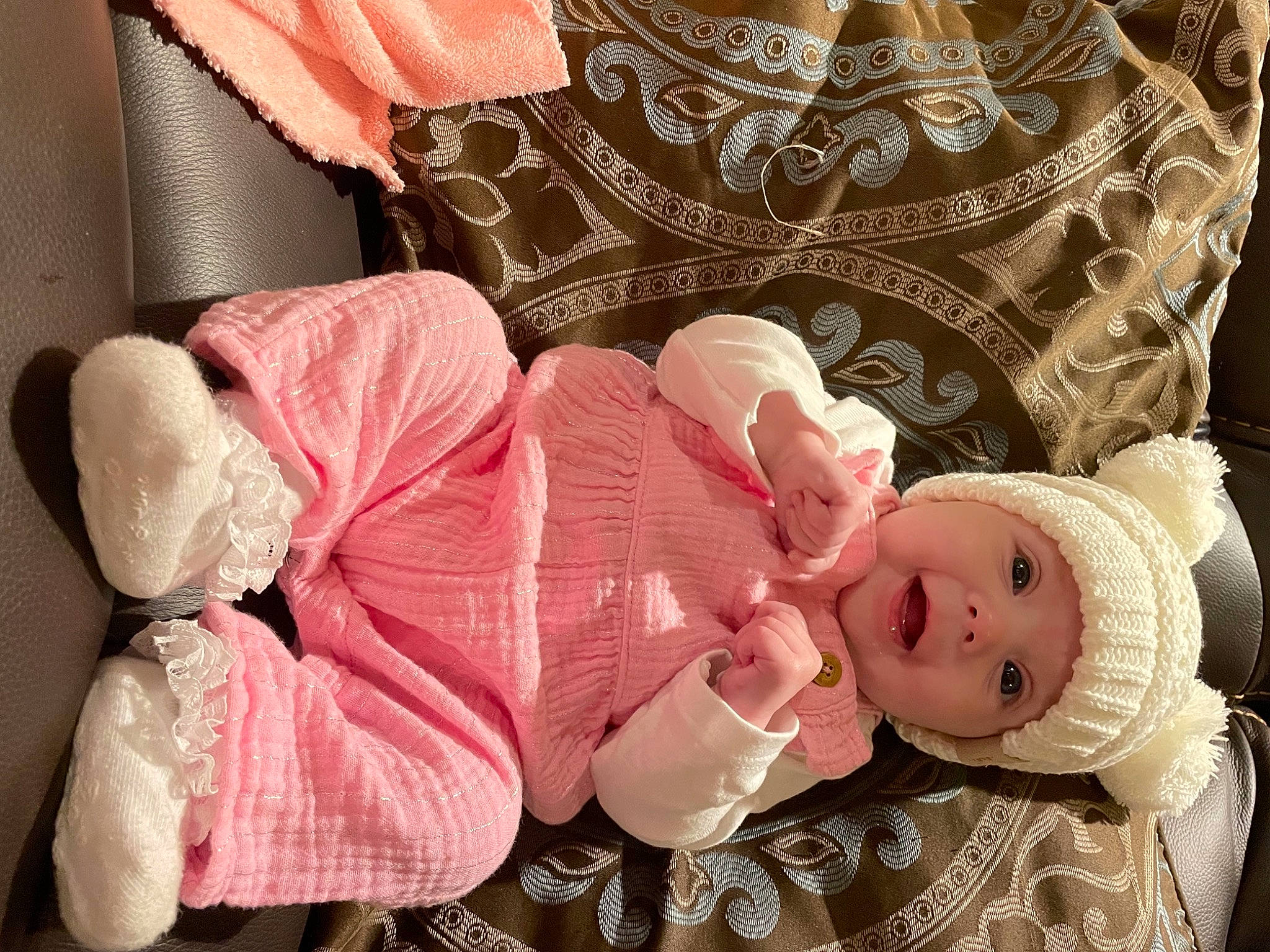 Cassidy is registered to the contest to win money with this photo: baby, baby_products, baby_sleeping, baby_toddler_clothing, cheek, child, comfort, fashion_accessory, happy, hat, headgear, headwear, linens, lip, pattern, peach, person, pink, product, skin