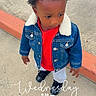 Deshawn joined the competition — help win amazing prizes! toddler, child, curly_hair, denim_jacket, red_shirt, pants, black_shoes, sidewalk, curb, outdoor, casual, street, concrete, person, young_child, daytime, fashion, portrait, standing, text_overlay