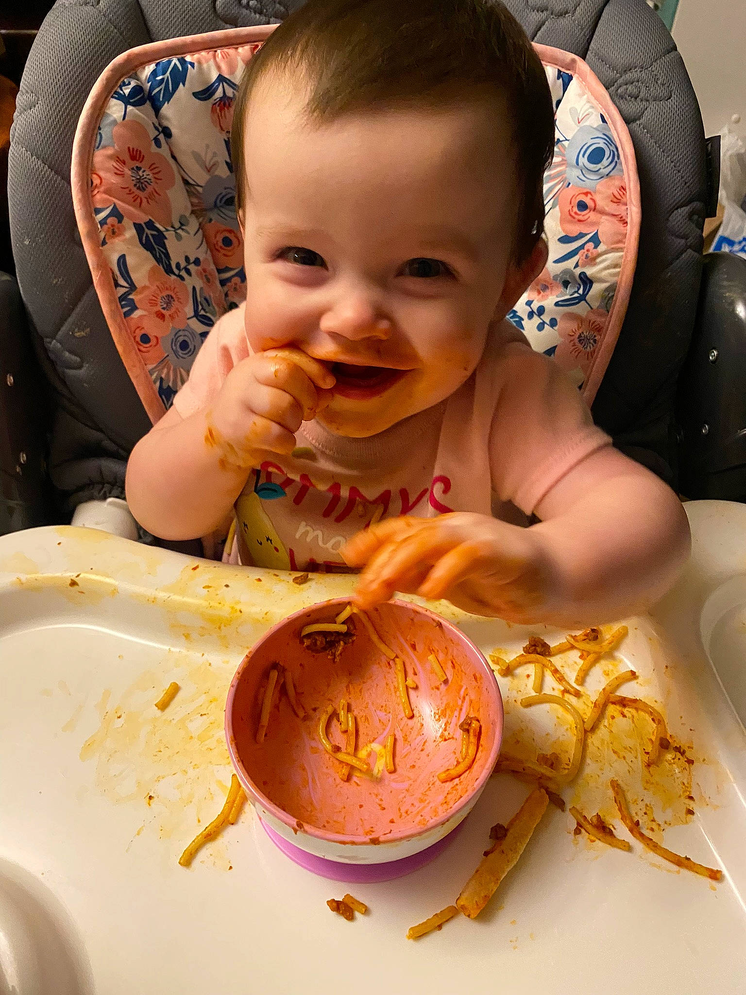 Paige is registered to the contest to win money with this photo: art, baby, cake_decorating, chair, cuisine, dish, dishware, food, food_craving, happy, ingredient, joy, kitchen_utensil, mouth, orange, person, plate, serveware, smile, sweetness