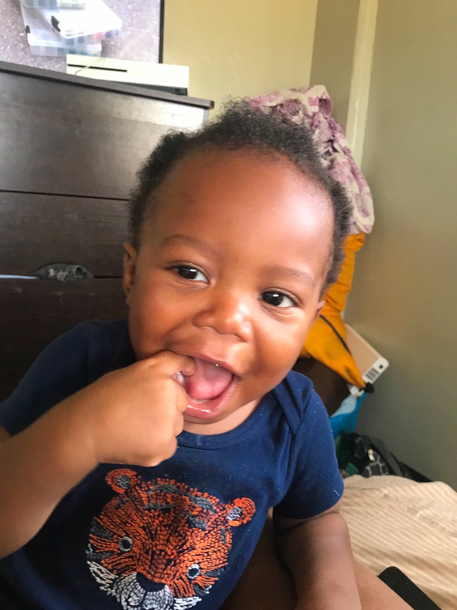 Noel is registered to the contest to win money with this photo: baby, black_hair, cheek, child, chin, ear, eating, face, food, forehead, hair, hairstyle, head, lip, neck, nose, person, skin, smile, toddler