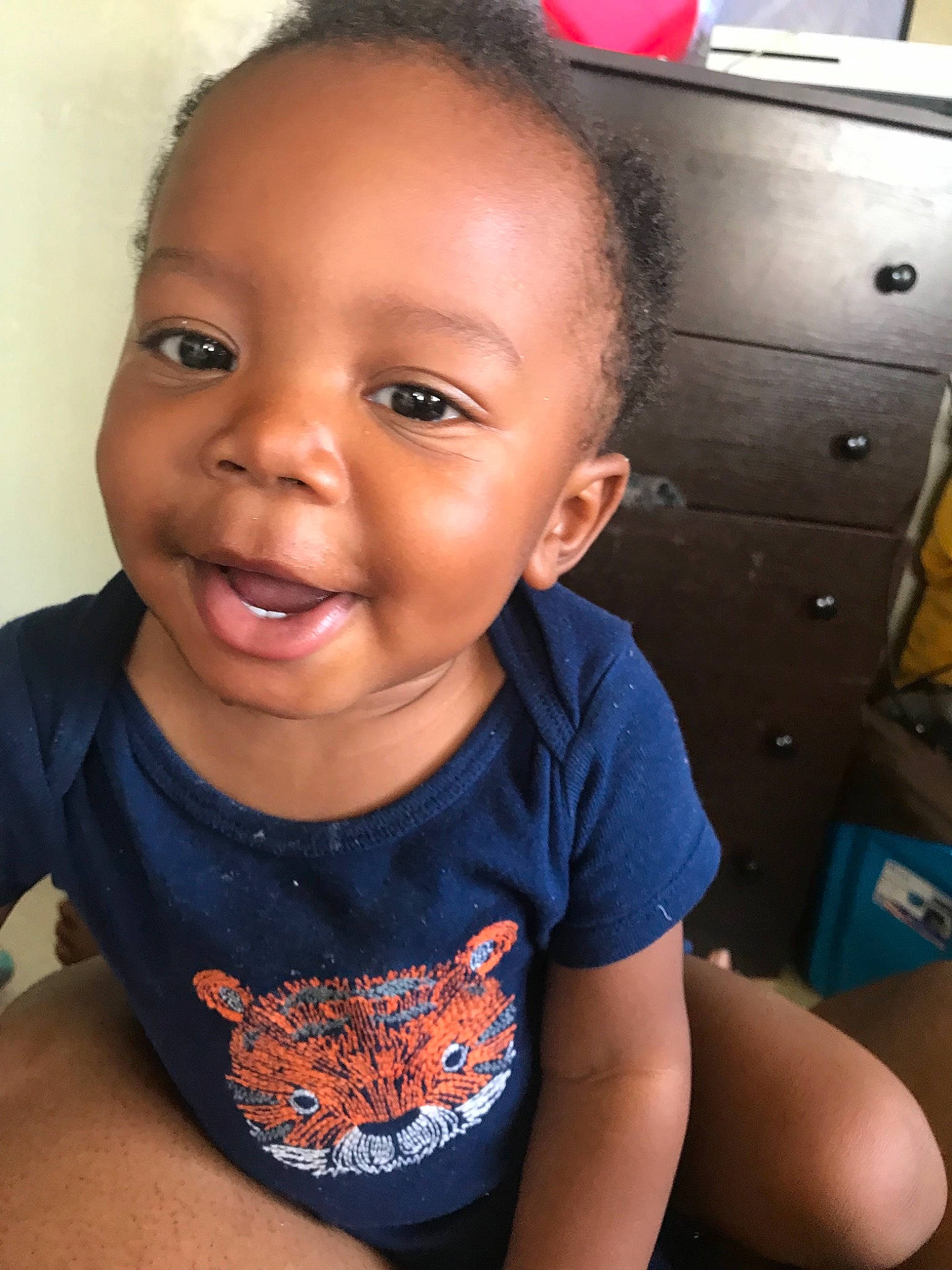 Noel is registered to the contest to win money with this photo: black_hair, cheek, child, chin, eyebrow, face, facial_expression, forehead, hair, head, lip, nose, person, skin, smile, toddler