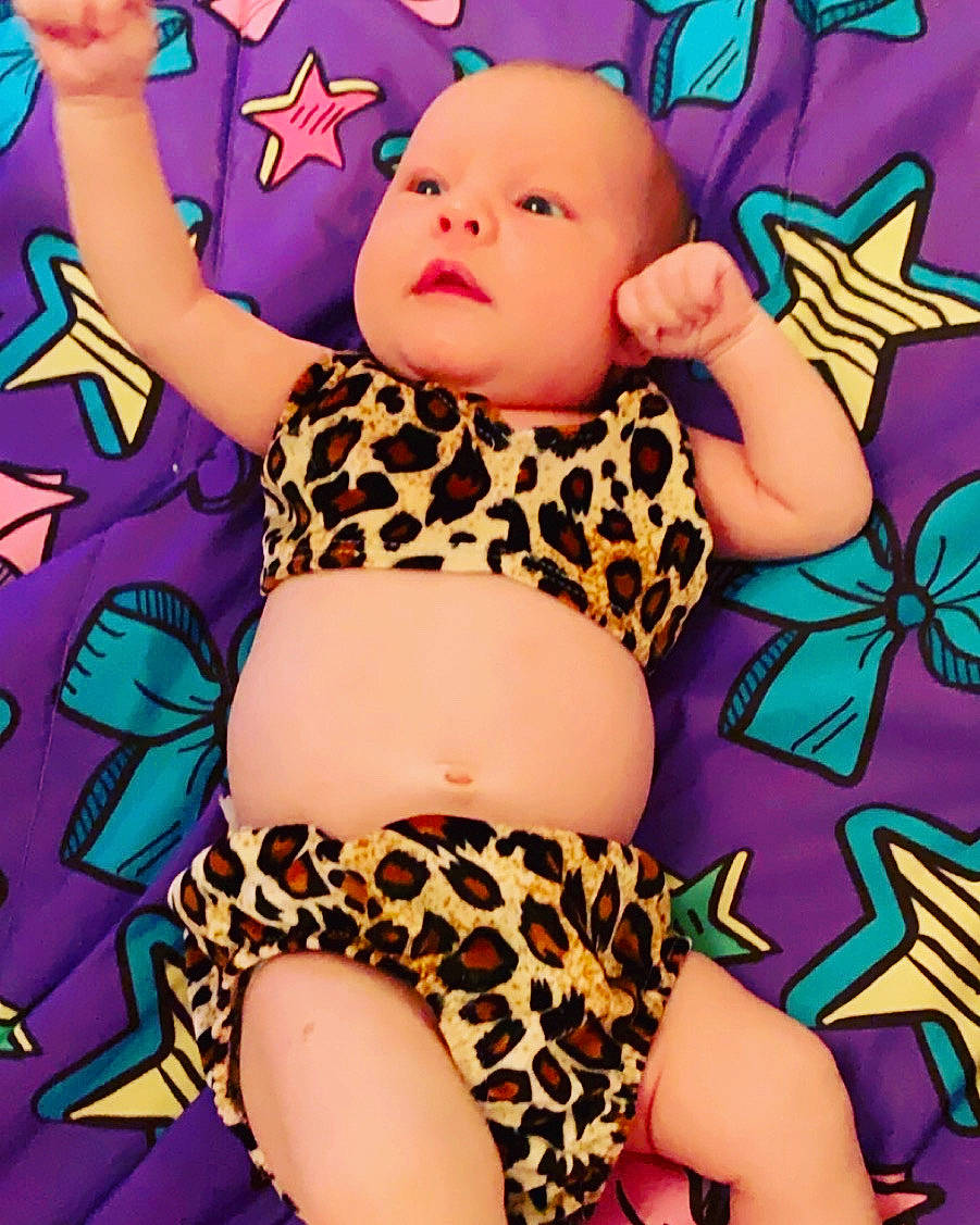 Kacie is registered to the contest to win money with this photo: baby, child, design, fictional_character, pattern, person, thigh, toddler