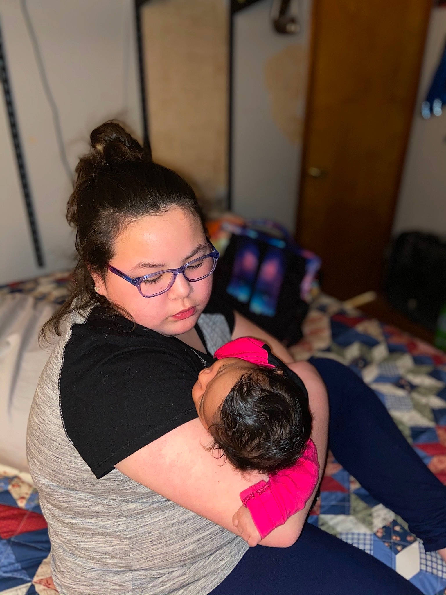 Isabella is registered to the contest to win money with this photo: abdomen, black_hair, comfort, elbow, eyewear, flooring, glasses, happy, human_leg, joint, knee, leisure, long_hair, neck, person, shoulder, thigh, trunk, vertebrate, vision_care