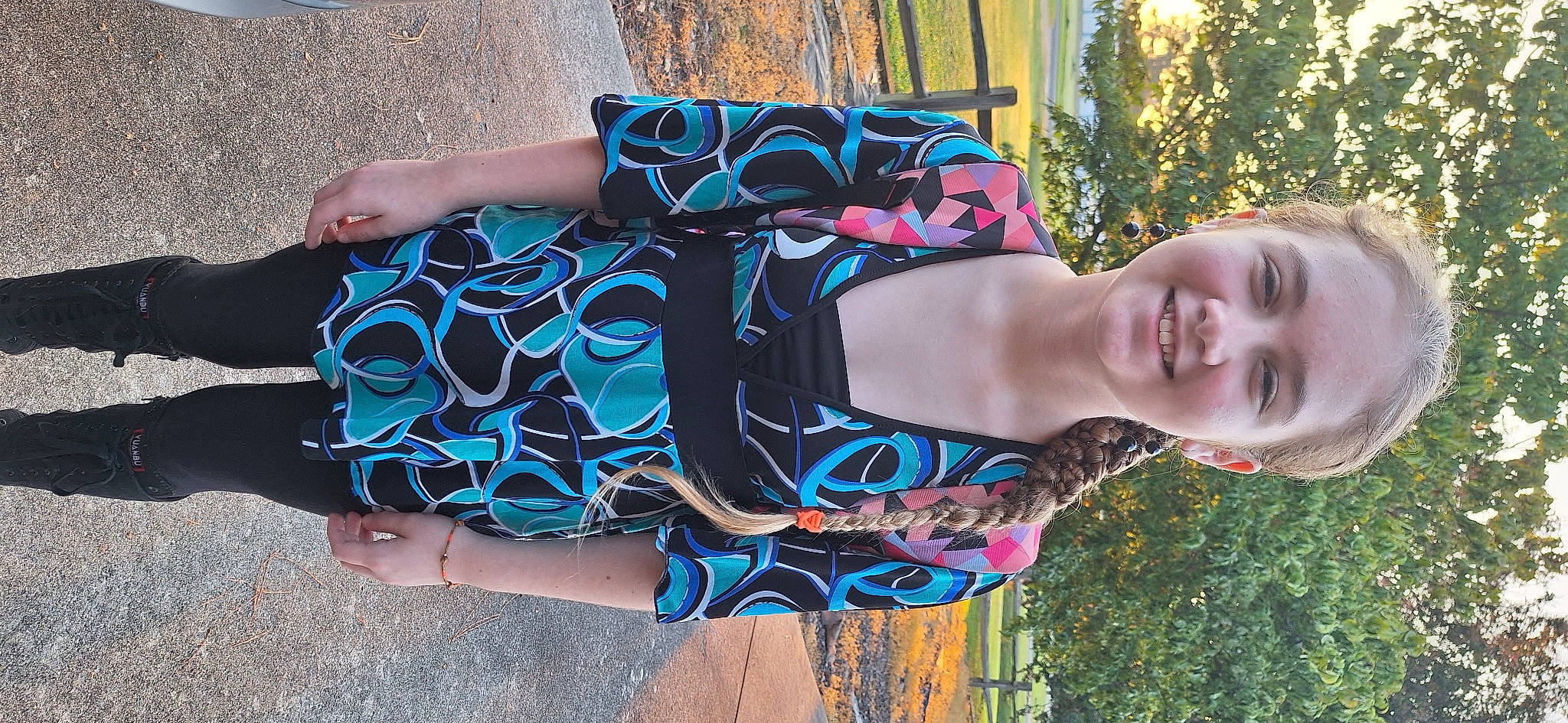 Kyleigh is registered to the contest to win money with this photo: azure, beauty, black_hair, cool, dress, electric_blue, eyewear, face, fashion, grass, happy, joy, pattern, people_in_nature, person, shoulder, smile, sunglasses, textile, tree